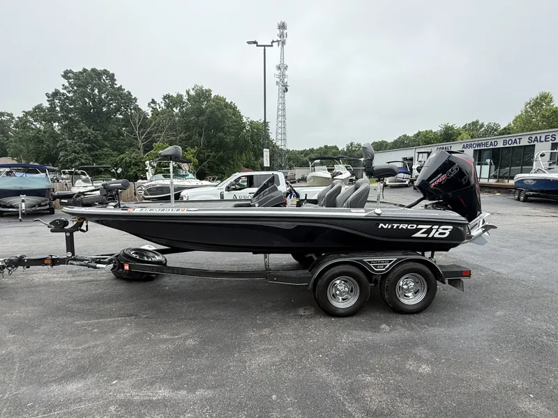Slide: The Image of A black Nitro Z18 Pro boat on a trailer at a boat sales lot. - 3