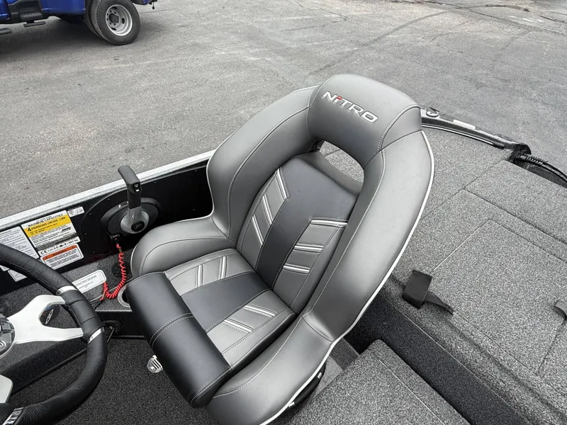 Slide: The Image of The seat of a 2023 Nitro Z18 Pro boat with gray upholstery and Nitro logo. - 5
