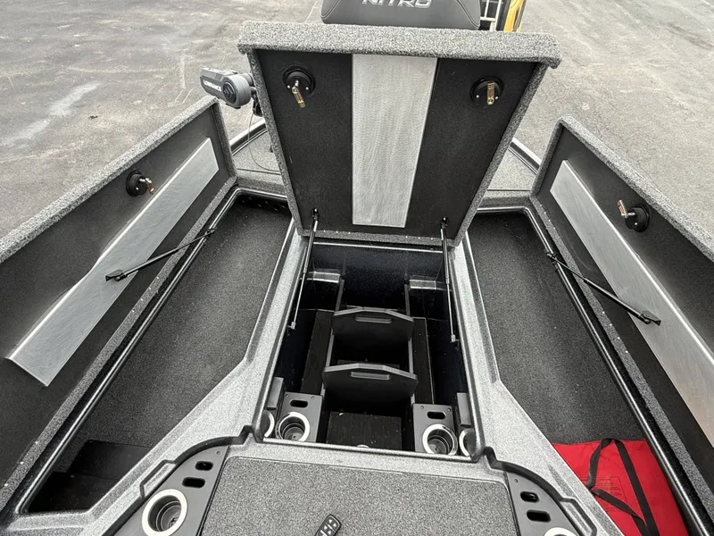 Slide: The Image of The image shows the open deck of a Nitro Z18 Pro boat with multiple storage compartments. - 11