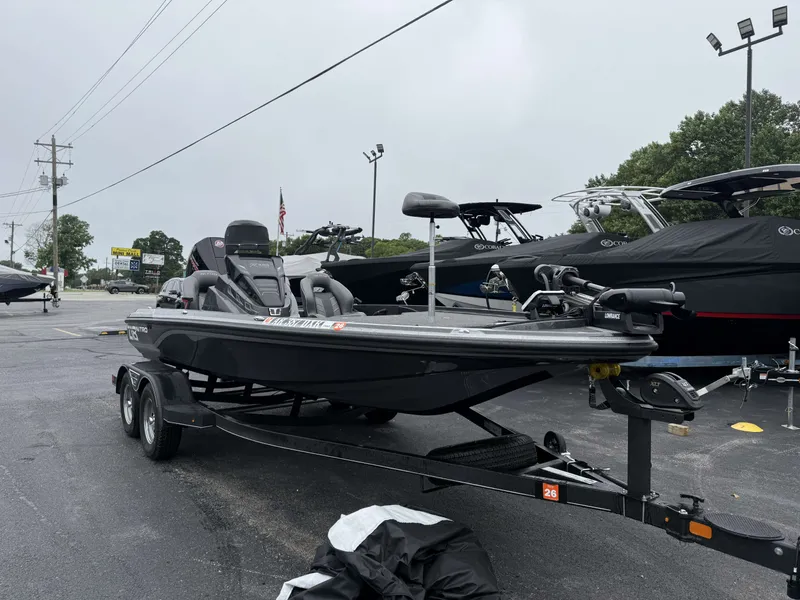 The Image of 2023 Nitro Z18 Pro on a trailer in a parking lot, surrounded by other boats. - 1