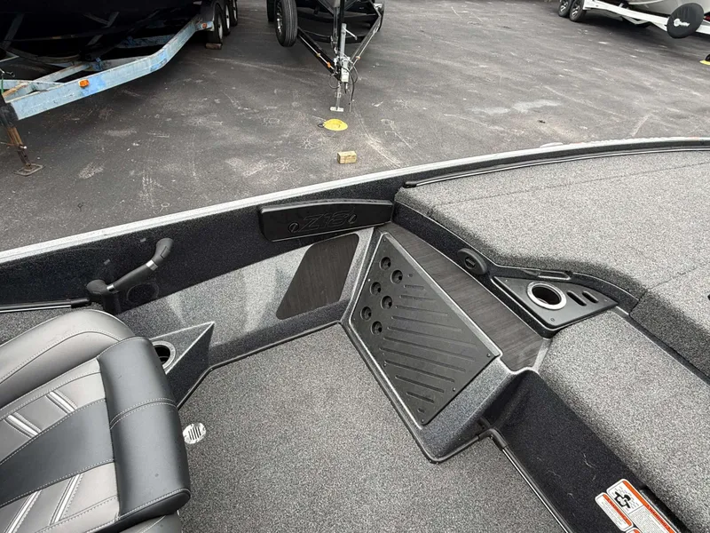 Slide: The Image of The image shows the cockpit of a Nitro Z18 Pro boat with gray carpeting. - 22