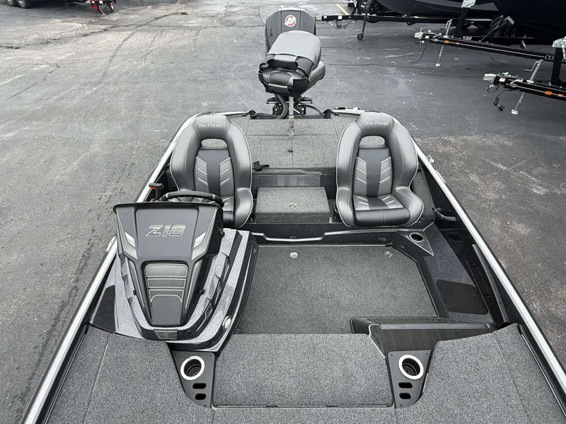 Slide: The Image of The image shows a modern boat with gray seats and a motor in the background. - 15
