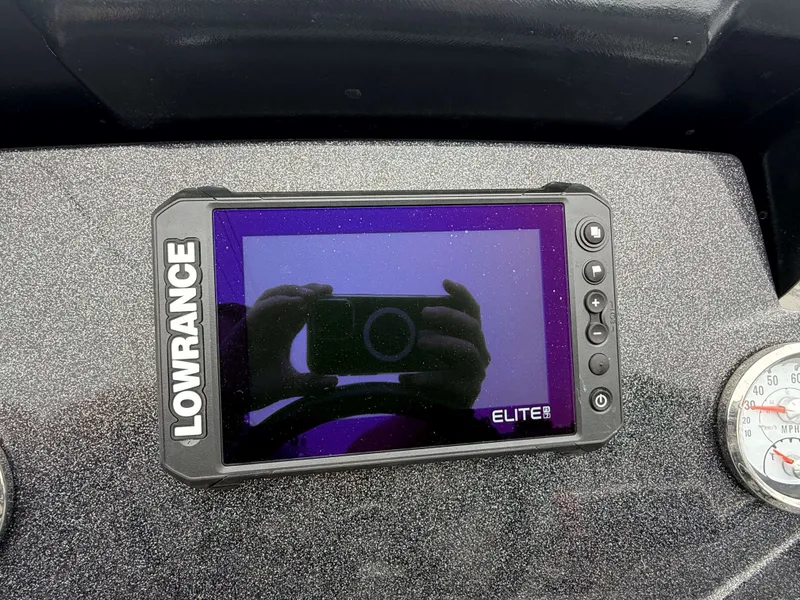 Slide: The Image of A Lowrance Elite 9 screen is embedded in a boat's dashboard. - 7