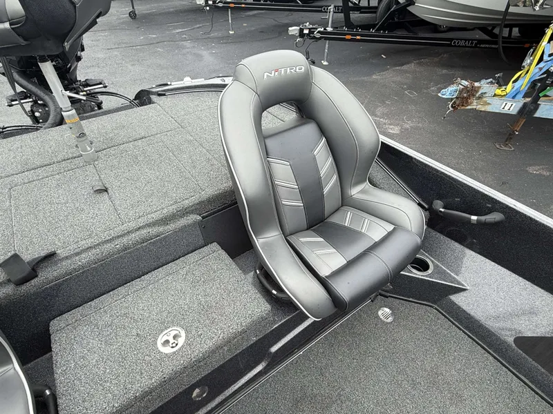 Slide: The Image of A gray seat on a Nitro Z18 Pro boat, surrounded by gray carpeting. - 21