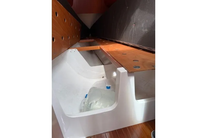 Slide: The Image of Interior view of 2000 X-Yachts X-362 Sport sailboat with wooden and white fiberglass elements. - 17