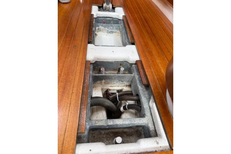 Slide: The Image of Interior view of 2000 X-Yachts X-362 Sport, showcasing wooden flooring and storage compartments. - 22