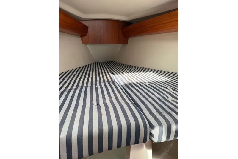 Slide: The Image of Interior cabin of 2000 X-Yachts X-362 Sport with striped bedding. - 19
