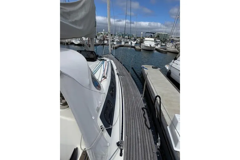 Slide: The Image of Sailing yacht X-Yachts X-362 Sport, 2000 model, docked in a marina under blue skies. - 27
