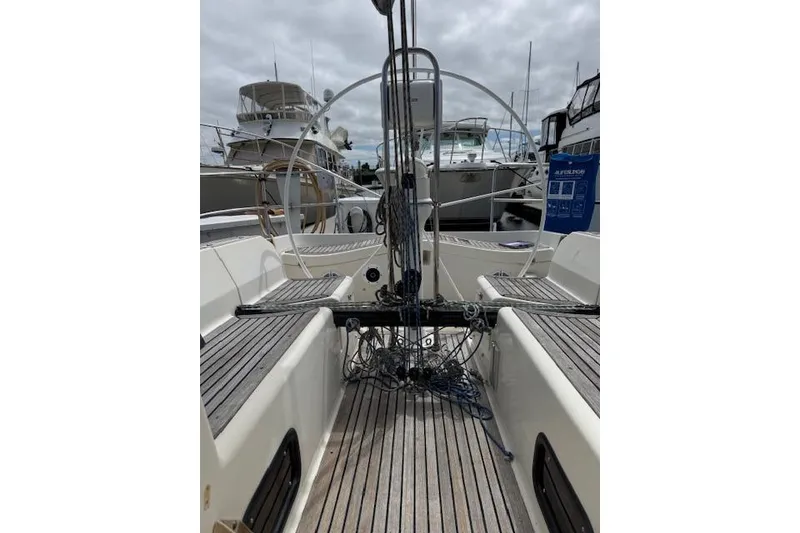 Slide: The Image of 2000 X-Yachts X-362 Sport sailboat cockpit with wooden deck and steering wheel. - 23