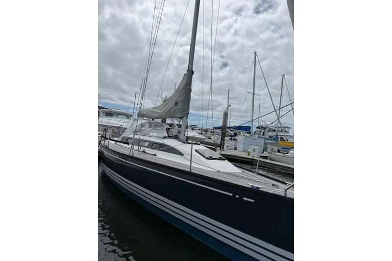 Slide: The Image of 2000 X-Yachts X-362 Sport sailboat docked at marina under cloudy sky. - 4