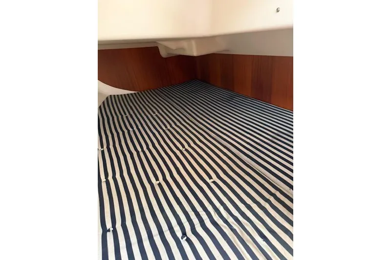 Slide: The Image of Interior cabin of 2000 X-Yachts X-362 Sport with striped bedding. - 20