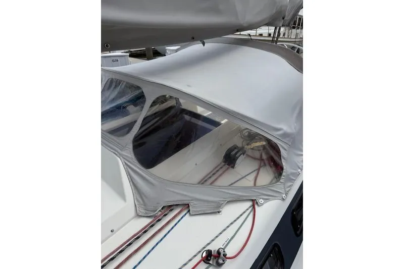 Slide: The Image of 2000 X-Yachts X-362 Sport sailboat with protective cover and visible rigging. - 6