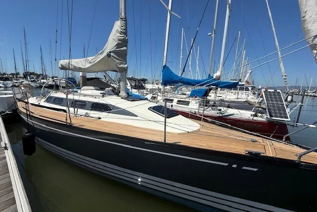 Slide: The Image of 2000 X-Yachts X-362 Sport sailboat docked in a marina under clear blue skies. - 2