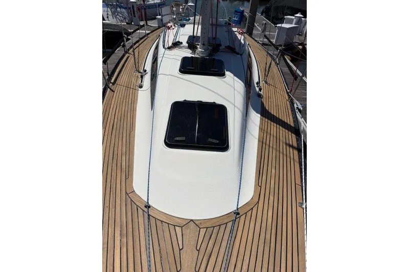 Slide: The Image of 2000 X-Yachts X-362 Sport sailboat deck with teak finish and hatches. - 3