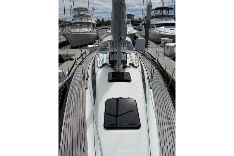 Slide: The Image of Sleek 2000 X-Yachts X-362 Sport sailboat docked at marina, showcasing elegant design. - 29