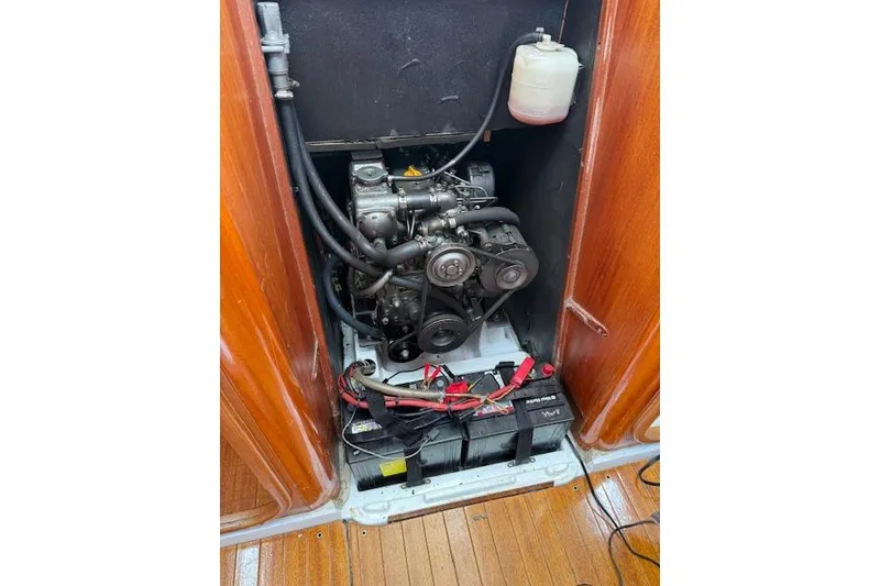 Slide: The Image of Engine compartment of a 2000 X-Yachts X-362 Sport sailboat, featuring visible components and battery. - 26