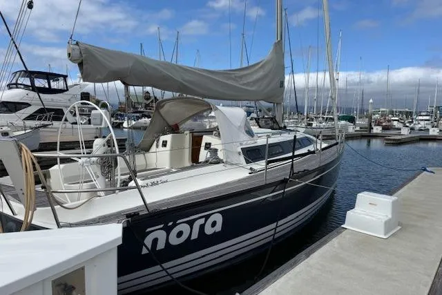 Slide: The Image of 2000 X-Yachts X-362 Sport sailboat docked at marina under cloudy sky. - 2