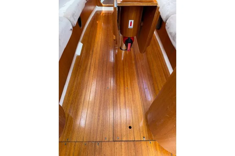 Slide: The Image of Interior view of 2000 X-Yachts X-362 Sport, featuring polished wooden flooring. - 21