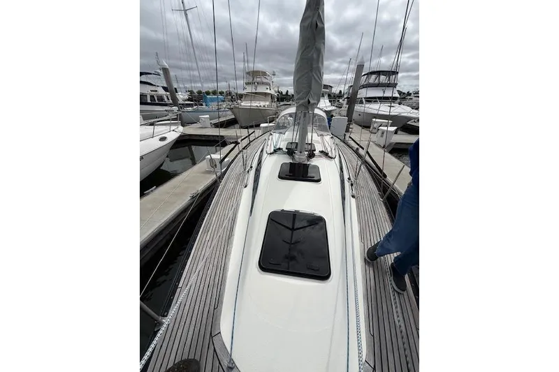 Slide: The Image of 2000 X-Yachts X-362 Sport sailboat docked at marina, showcasing sleek deck design. - 7