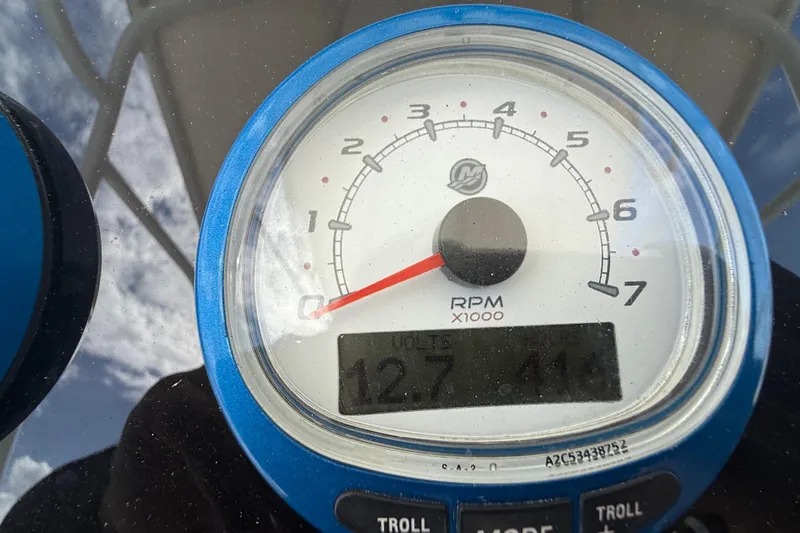 Slide: The Image of Close-up of a 2007 Donzi 29 ZF Open tachometer displaying RPM and voltage. - 32