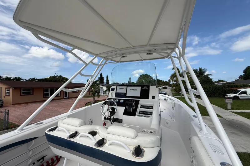 Slide: The Image of 2007 Donzi 29 ZF Open boat cockpit with steering wheel and control panel. - 9