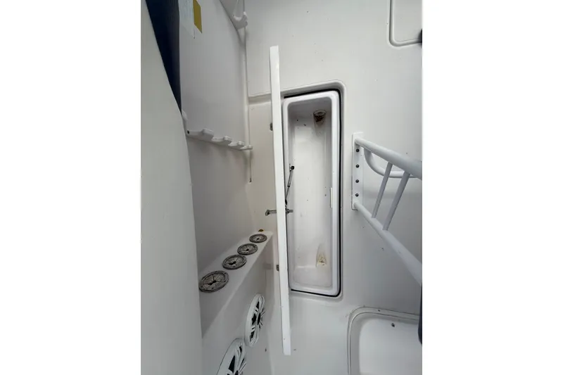 Slide: The Image of 2007 Donzi 29 ZF Open boat interior with storage compartments and speakers. - 19