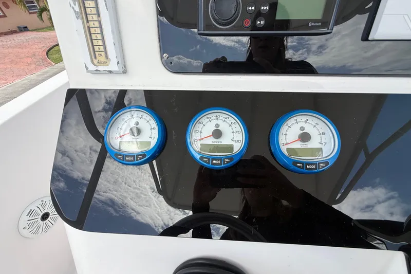 Slide: The Image of Dashboard of a 2007 Donzi 29 ZF Open boat with gauges and controls. - 27