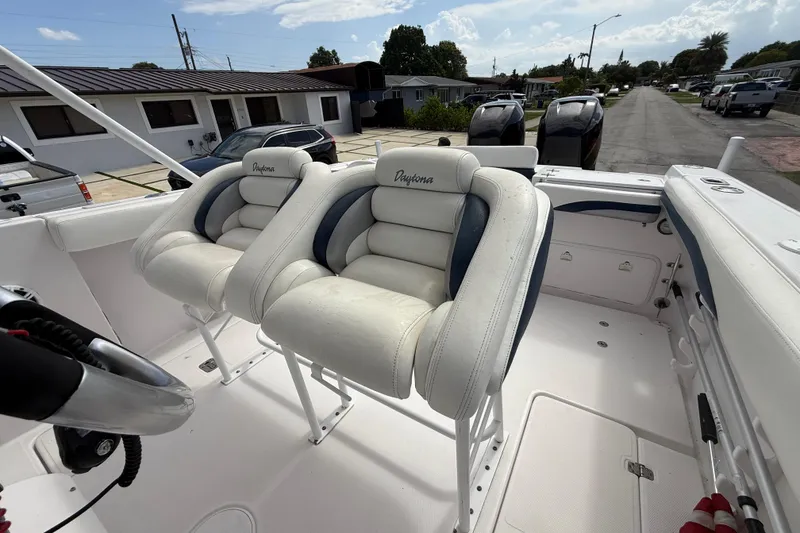 Slide: The Image of 2007 Donzi 29 ZF Open boat interior with white cushioned seats and steering wheel. - 54