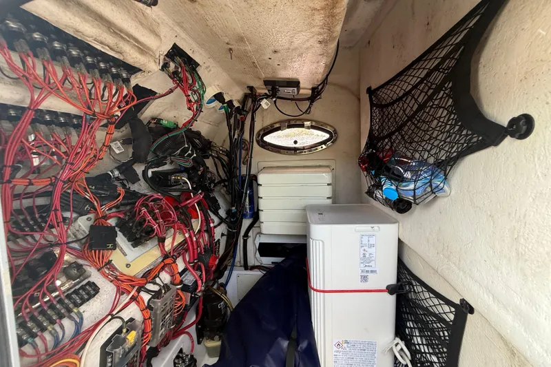 Slide: The Image of Interior view of 2007 Donzi 29 ZF Open boat showing wiring and storage compartments. - 38