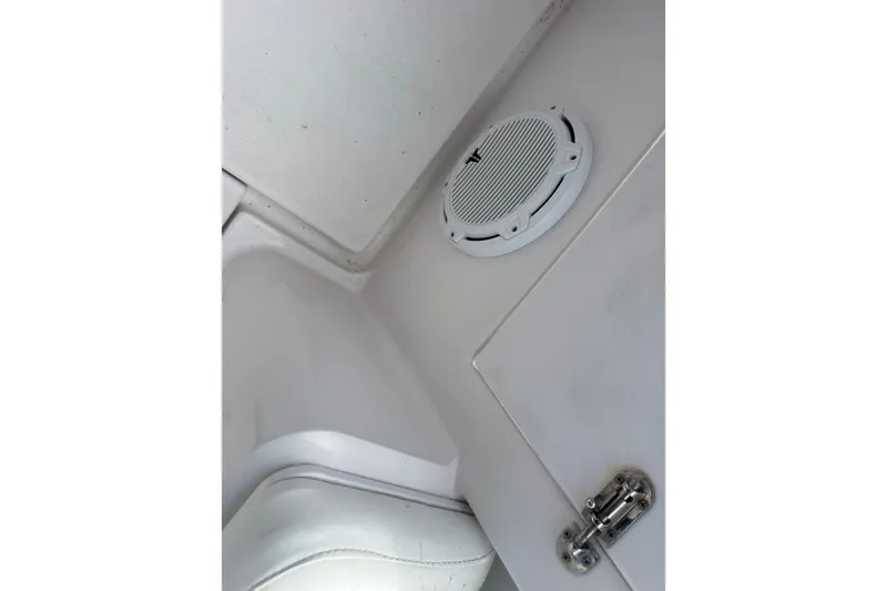 Slide: The Image of Interior of 2007 Donzi 29 ZF Open boat showing speaker and storage compartment. - 58