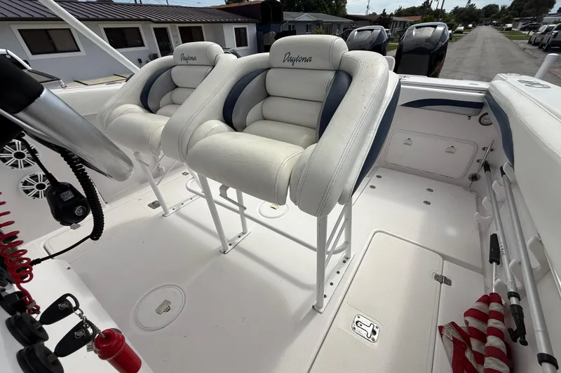 Slide: The Image of 2007 Donzi 29 ZF Open boat interior with white and blue seating. - 55