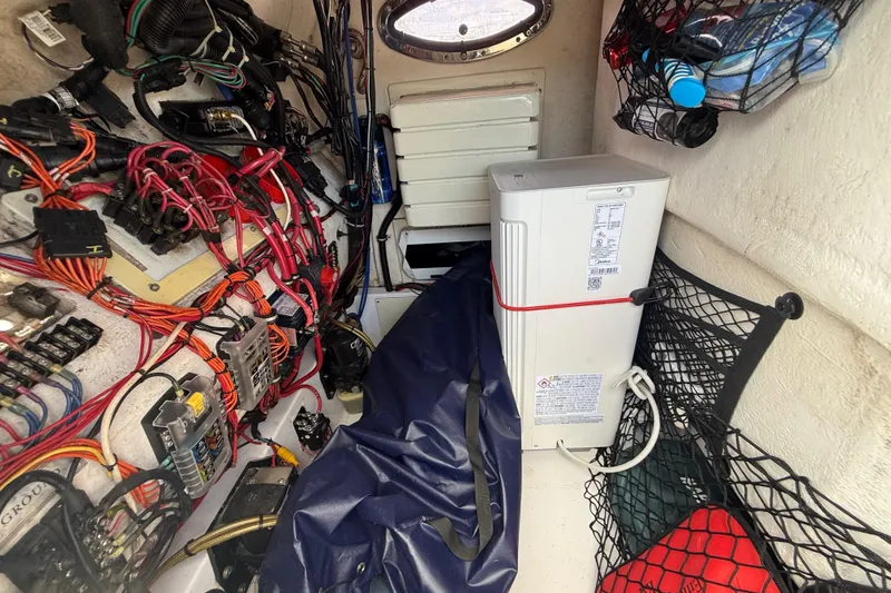 Slide: The Image of Interior of a 2007 Donzi 29 ZF Open boat showing wiring and storage compartments. - 39