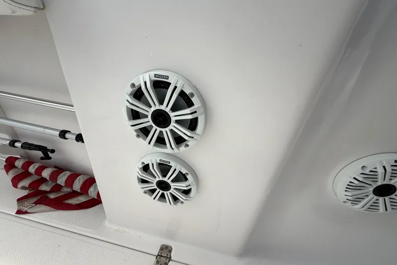 Slide: The Image of Speakers on a 2007 Donzi 29 ZF Open boat interior, featuring Kicker audio system. - 53