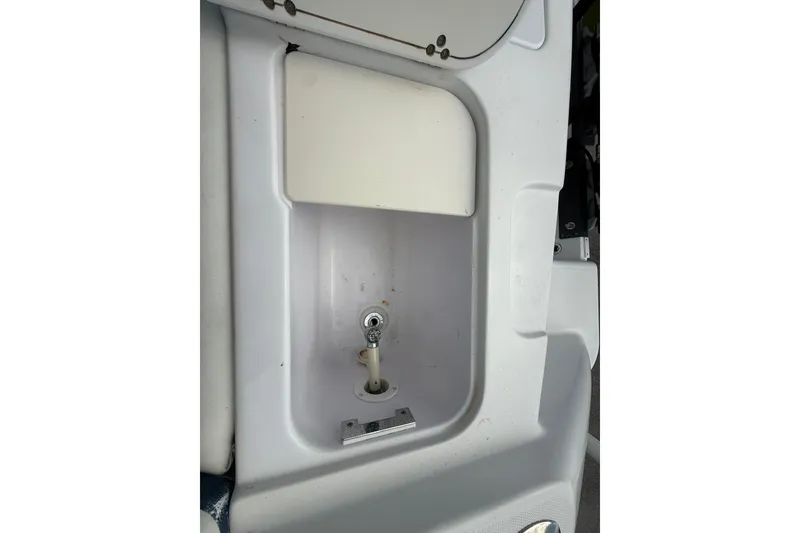 Slide: The Image of 2007 Donzi 29 ZF Open boat sink detail with faucet and storage compartment. - 17