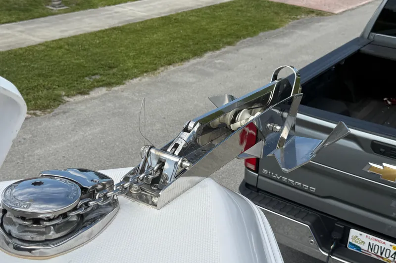 Slide: The Image of Chrome anchor and chain on a 2007 Donzi 29 ZF Open boat, parked near a Chevrolet Silverado. - 44