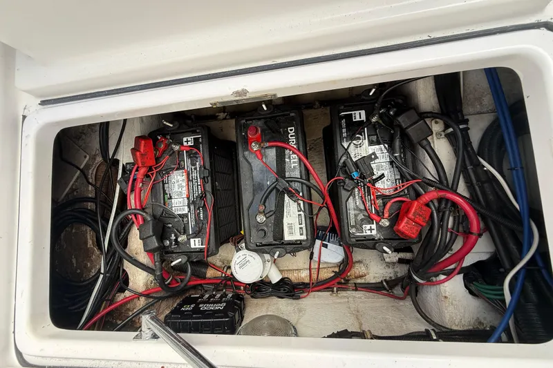 Slide: The Image of Battery compartment of a 2007 Donzi 29 ZF Open boat with wiring. - 11