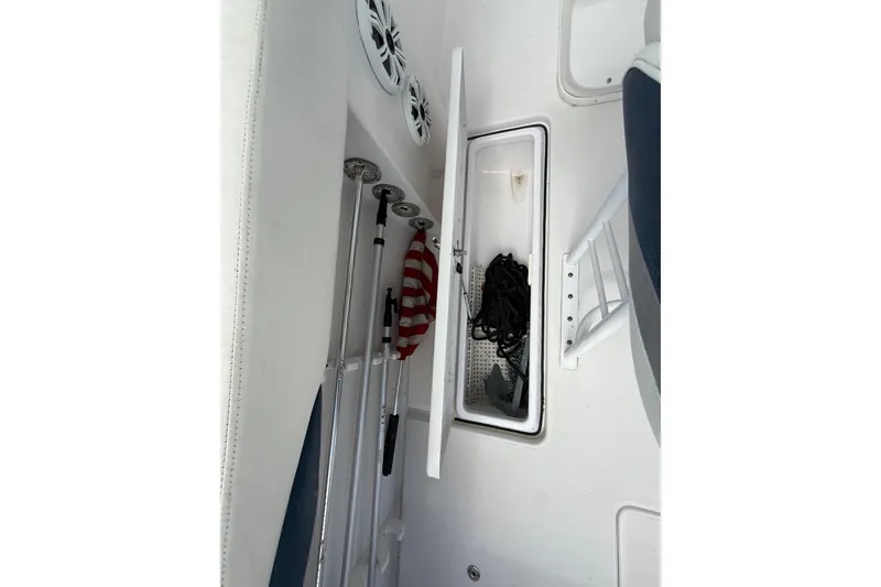 Slide: The Image of 2007 Donzi 29 ZF Open boat interior with storage compartment and equipment. - 21