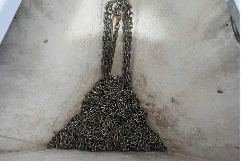 Slide: The Image of Anchor chain in a 2007 Donzi 29 ZF Open boat compartment. - 42
