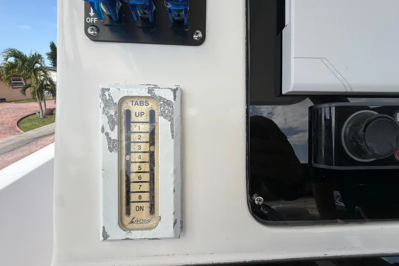 Slide: The Image of 2007 Donzi 29 ZF Open boat control panel with trim tab indicator. - 28
