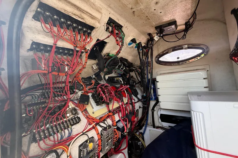 Slide: The Image of Electrical wiring inside a 2007 Donzi 29 ZF Open boat, showcasing complex circuitry. - 37