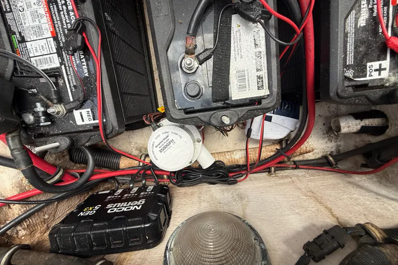 Slide: The Image of Battery compartment of a 2007 Donzi 29 ZF Open boat with wiring and components. - 12