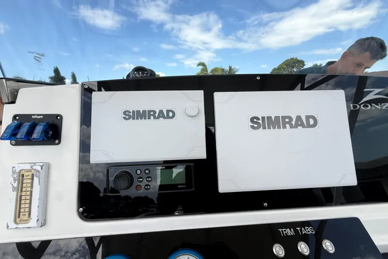 Slide: The Image of Dashboard of a 2007 Donzi 29 ZF Open boat with Simrad navigation equipment. - 26