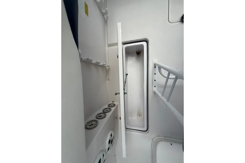 Slide: The Image of Interior view of a 2007 Donzi 29 ZF Open boat, featuring storage compartments. - 20