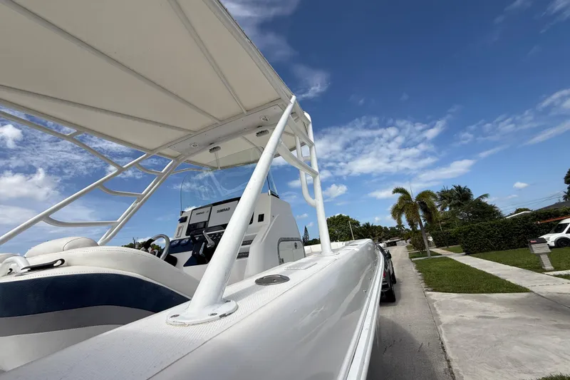 Slide: The Image of 2007 Donzi 29 ZF Open boat on trailer under clear blue sky. - 60