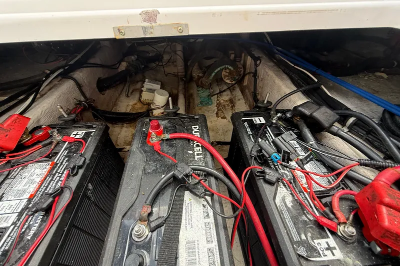 Slide: The Image of Battery compartment of a 2007 Donzi 29 ZF Open boat with wiring and connections. - 14