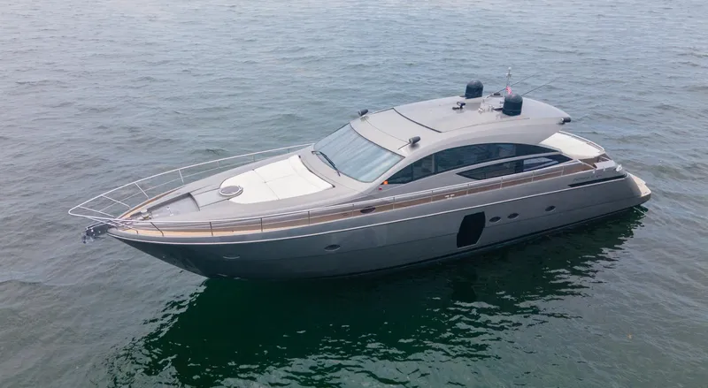 Slide: The Image of 2009 Pershing 64 yacht on calm water, showcasing sleek design and luxury features. - 3