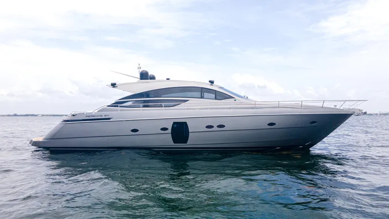 The Image of 2009 Pershing 64 yacht on calm water under a cloudy sky. - 1