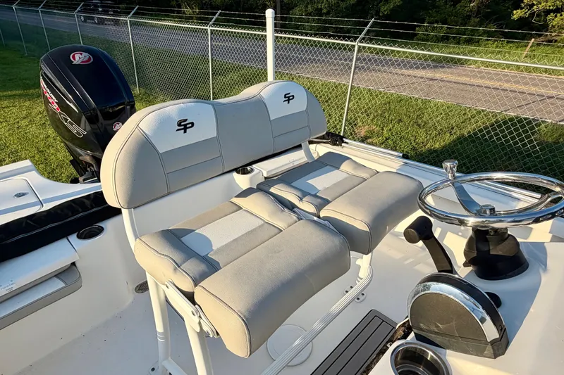 Slide: The Image of 2018 Sea Pro 208 Bay boat interior with dual seats and steering wheel. - 7