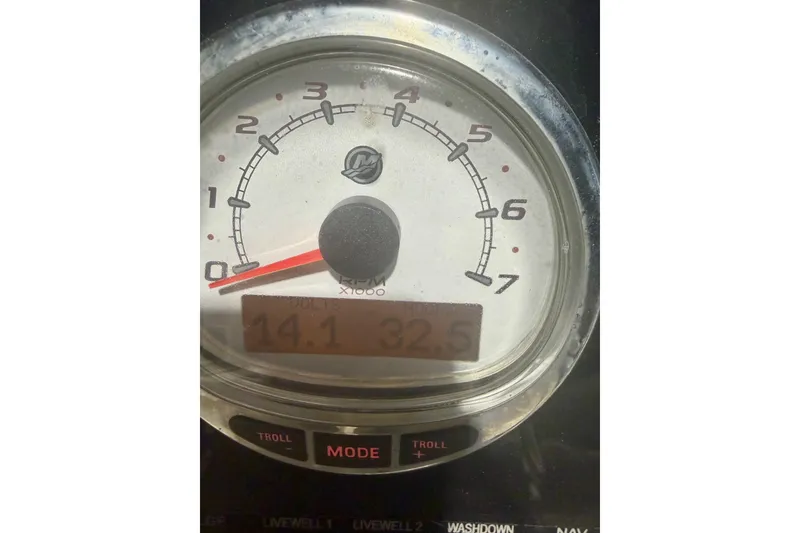Slide: The Image of Close-up of a 2018 Sea Pro 208 Bay boat tachometer displaying RPM and digital readings. - 11