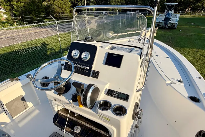 Slide: The Image of 2018 Sea Pro 208 Bay boat dashboard with steering wheel and gauges. - 6